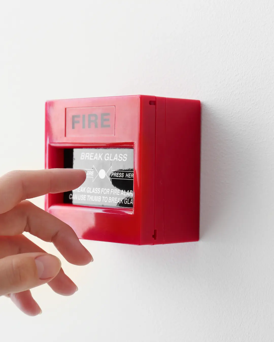 Engineer inspecting commercial fire alarm panel